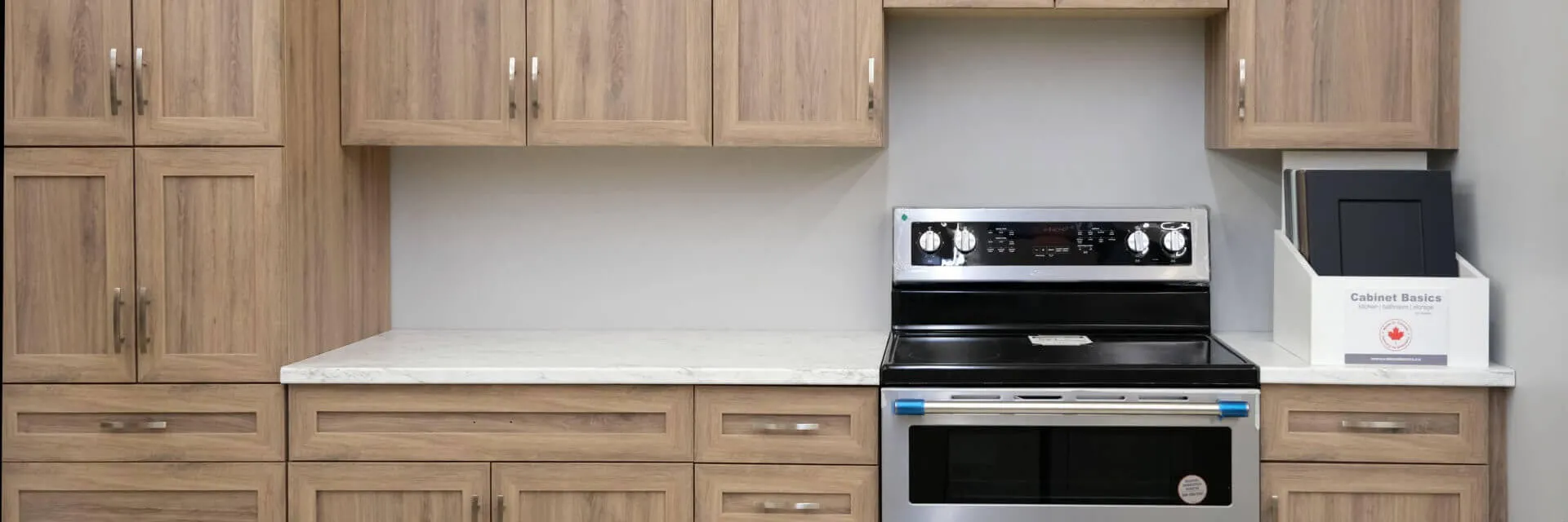 A kitchen with cabinets, counter and range installed